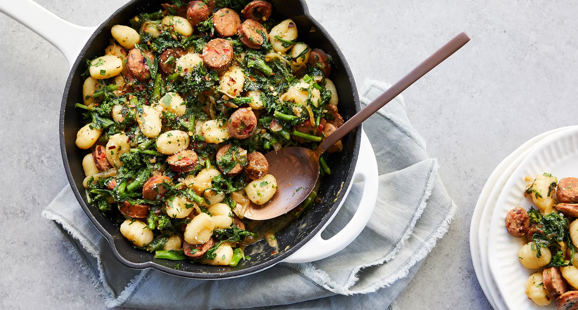 skillet gnocchi with sausage and broccoli rabe: skillet gnocchi with sausage and broccoli rabe on a linen