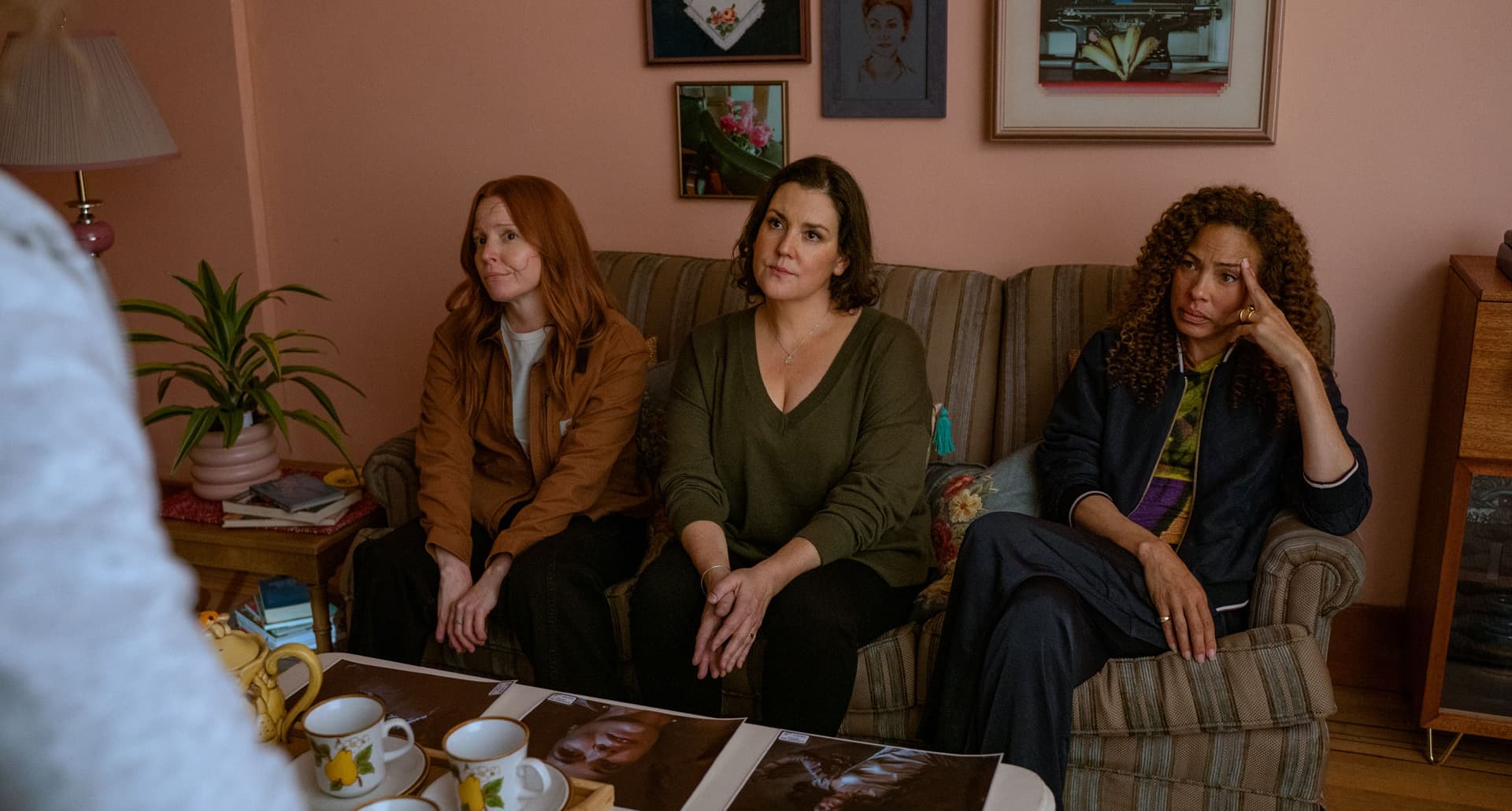 yellowjackets-season-3-murderer-theory: A photo of Van, Shauna and Tai from Yellowjackets sitting on a couch.