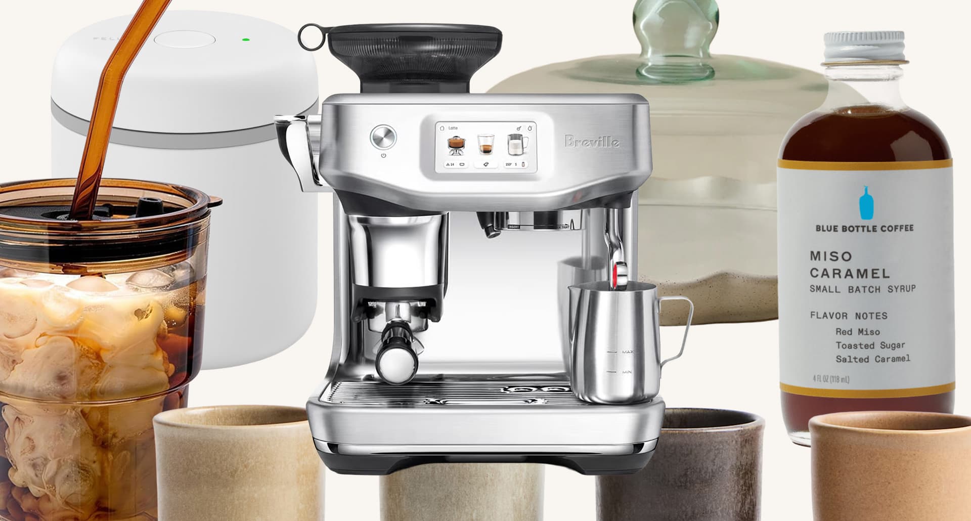 coffee making supplies like an espresso machine, syrup and cups